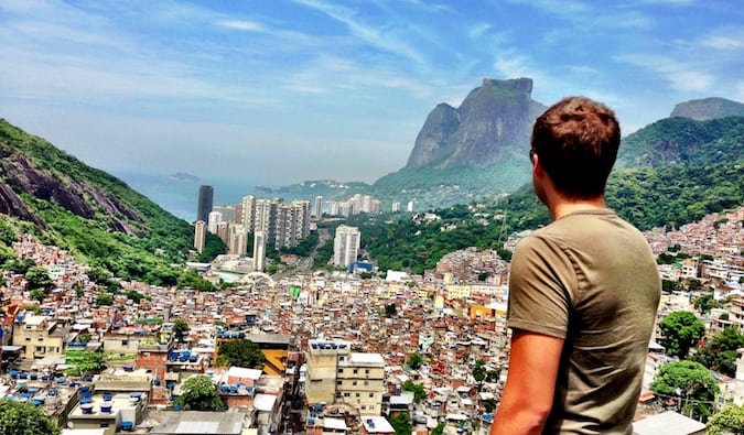 Mark Manson looking over a city in South America on a bright sunny day