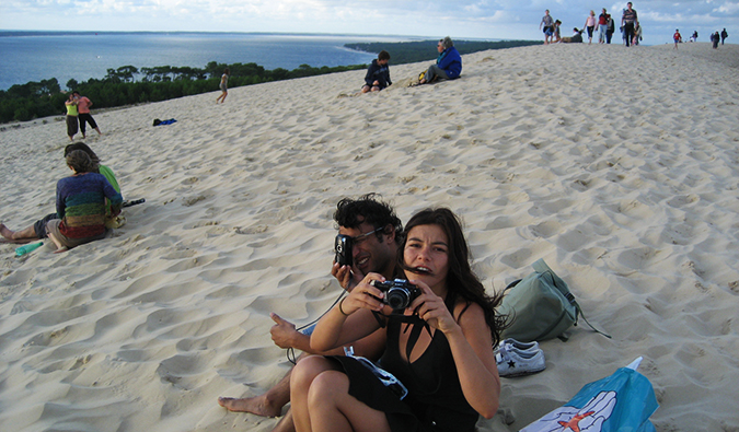 friends goofing off on a sand dune