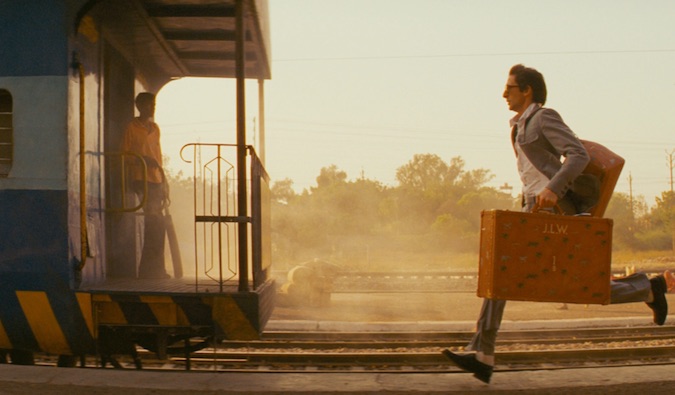 man running after a train in India movie called the darjeeling limited