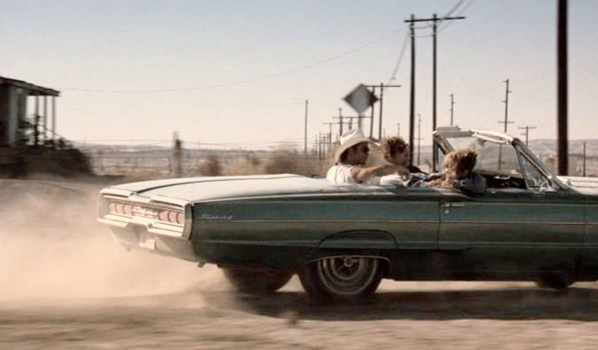 Thelma and Louise riding off famously in their convertible car
