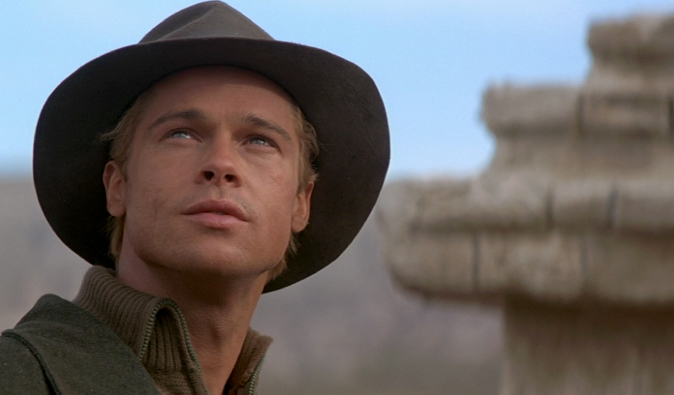 Brad Pitt in a hat in Tibet staring from the 7 Years in Tibet film