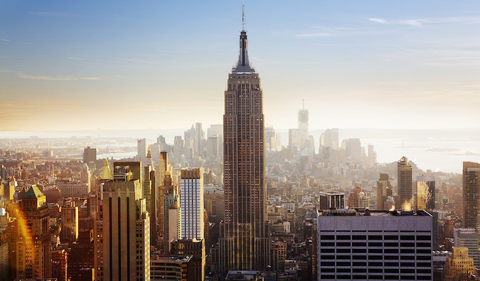 Empire State Building and NY skyline at dawn