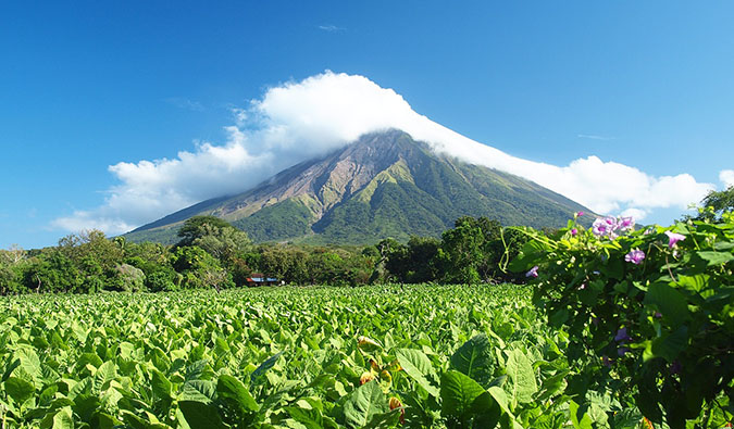 Nomadic Matt hiking a volcano in Nicaragua