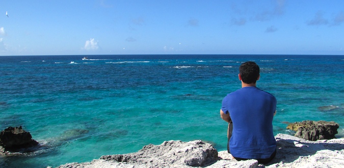 Nomadic Matt reflecting while staring at the ocean in Bermuda