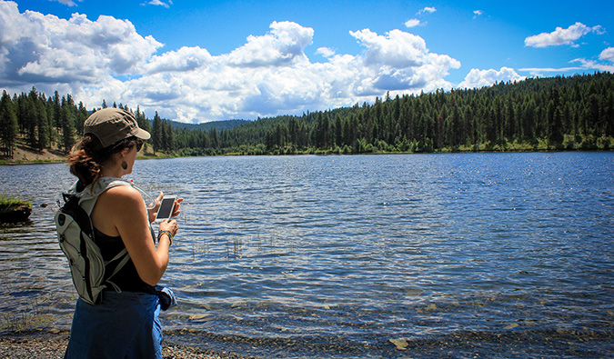 woman in red wading into the water