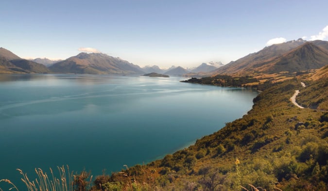 Forests and mountains surrounding a calm body of water in stunning New Zealand