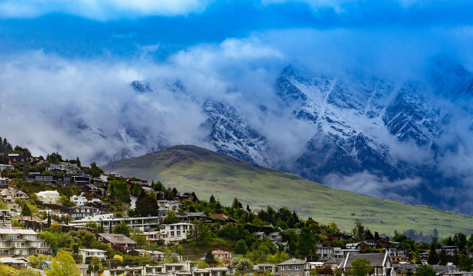 The city of Queenstown, New Zealand surrounded by mountains and nature