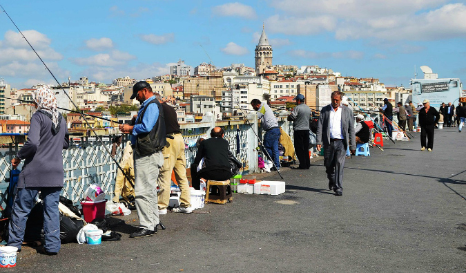 Lots of fisherman on Galata Bridge in Turkey on a cold day