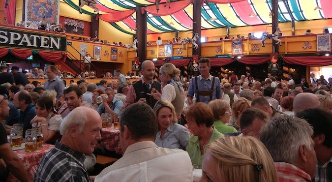 Nomadic Matt celebrating Oktoberfest inwards Federal Republic of Federal Republic of Germany amongst many beers How to Survive Oktoberfest