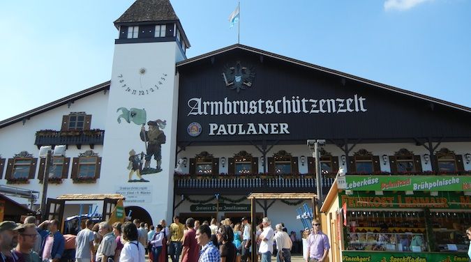 Nomadic Matt celebrating Oktoberfest inwards Federal Republic of Federal Republic of Germany amongst many beers How to Survive Oktoberfest