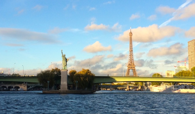 the Eiffel Tower and a small Statue of Liberty in Paris, France