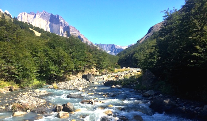 A rushing river surrounded by forests in Patagonia, Chile