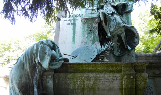 eerie photograph of the low-cal streaming on a crow at a cemetery Walking Among the Dead at Père Lachaise Cemetery