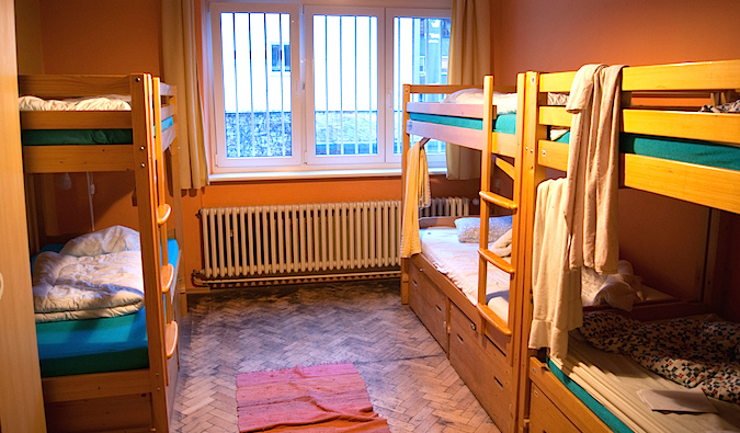 An empty  hostel dorm room in Spain with bunk beds