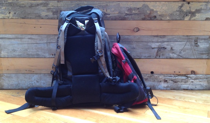 Two travel backpacks all packed and ready for an adventure