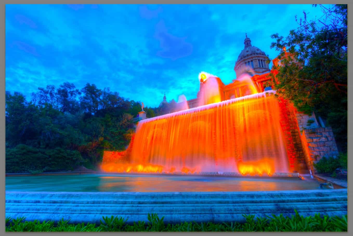 Photo of orante building and waterfall - neon - saturated