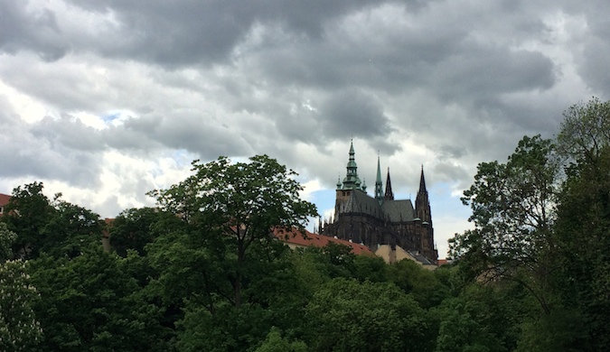 A Czech castle viewed from below ona cloudy day near Prague, Czechia