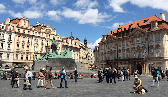 Sunny skies in Prague's busy central square during the summer