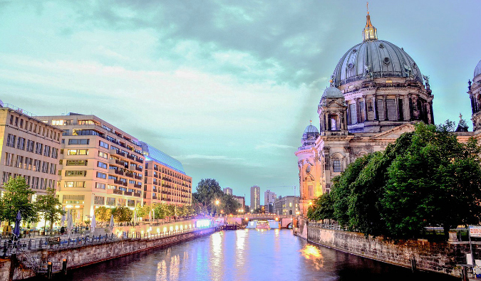 View down the Spree River at sunset with Museum Island on the right and the city on the left in Berlin, Germany