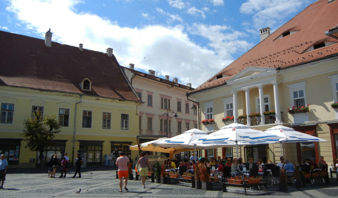 A busy market square in Romania on a sunny summer day