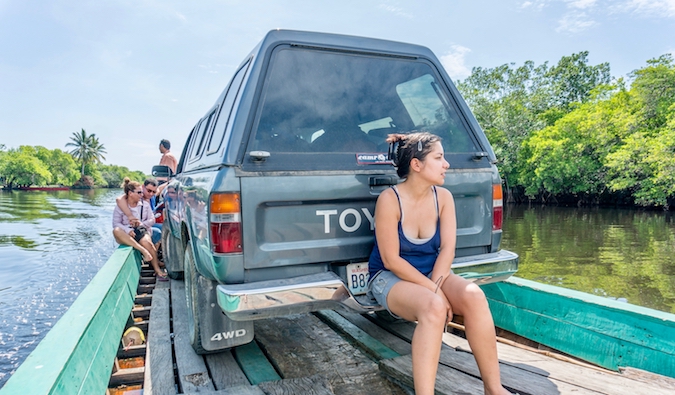 Ferrying an old truck across a narrow river in South America