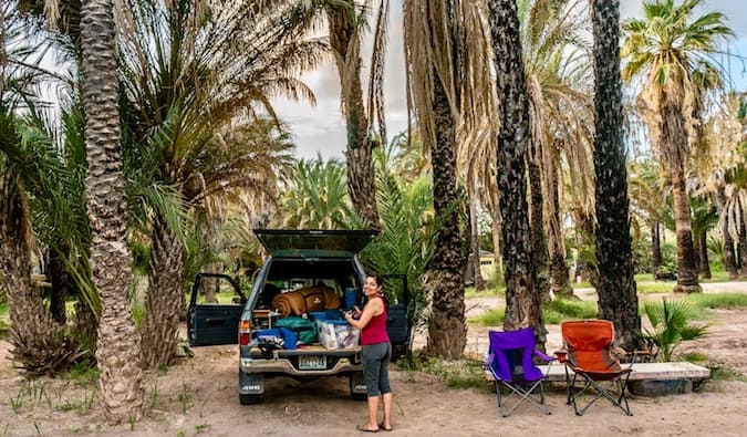 A truck parked near some trees while overlanding in South America