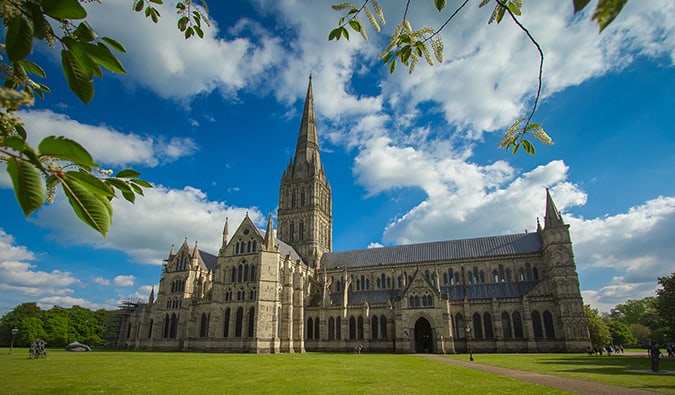 The massive Salisbury Cathedral on a bright and sunny day