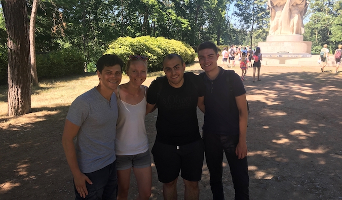 Travelers meeting together and posing for a photo in France