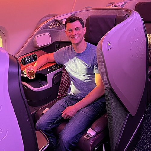 matt sitting in first class on a plane