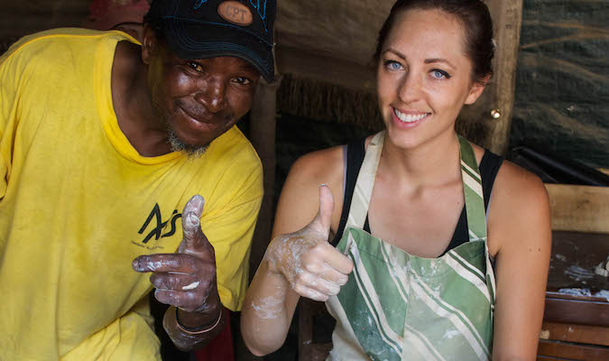 Solo traveler Kristin Addis making friends with the locals of South Africa