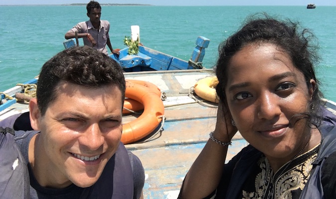 Nomadic Matt with a friendly guide on boat in Sri Lanka