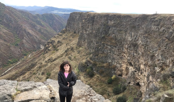 Staci standing on a cliff