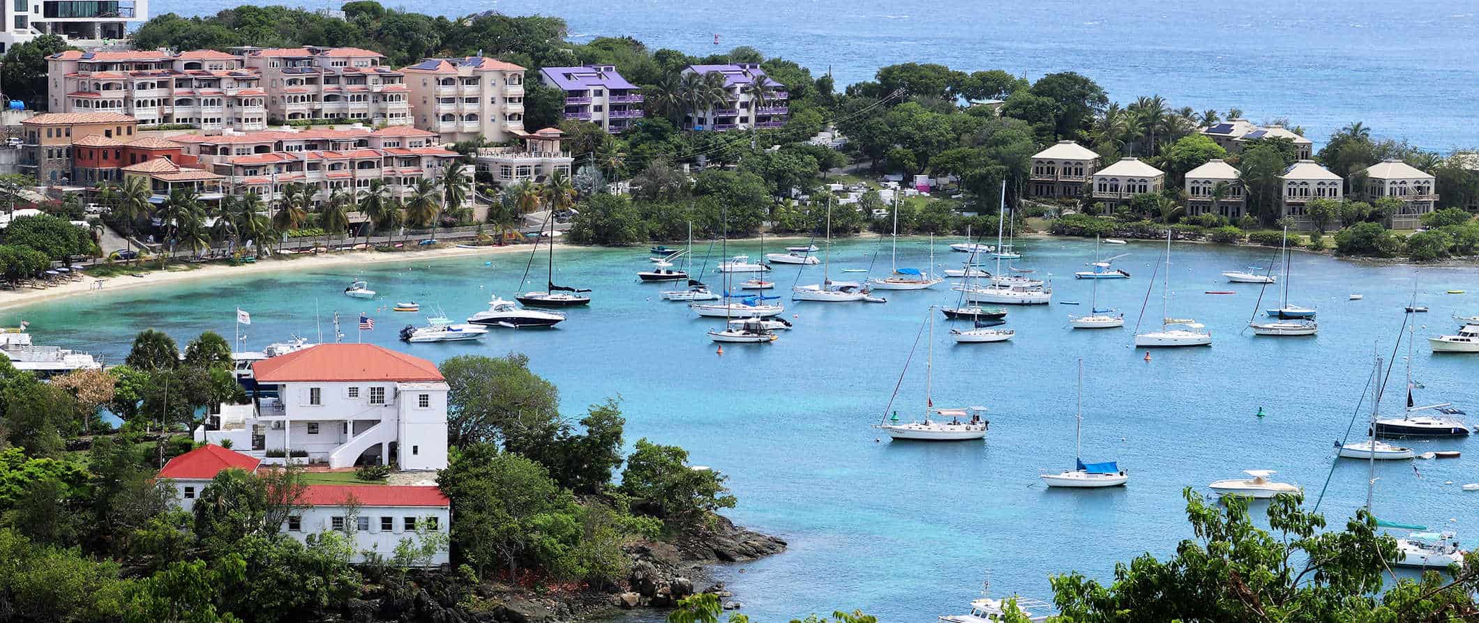 Sailboats in the picturesque harbor on the coast of  Saint John, USVI