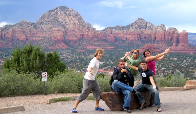 Nomadic Matt posing with friends in Sedona, AZ while on a road trip