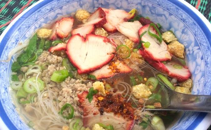 Thai red pork noodle soup photo