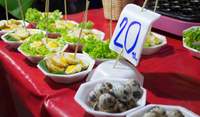 fried eggs sold on the street in thailand