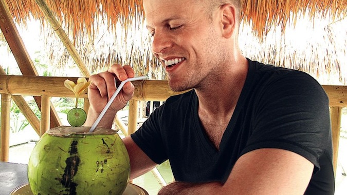 Tim Ferriss eating a coconut