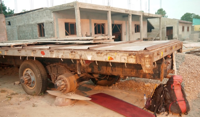 rough camping under a semi truck in Africa