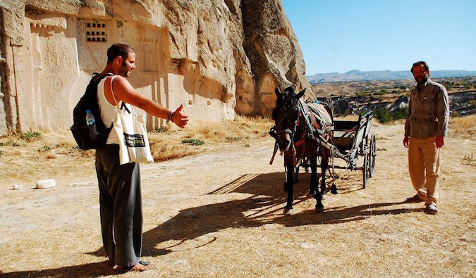 hitchhiking with a donkey in the desert overseas