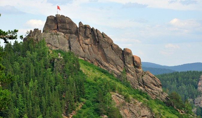 The green hills and rocky mountains of the Stobly Nature Reserve in Russia