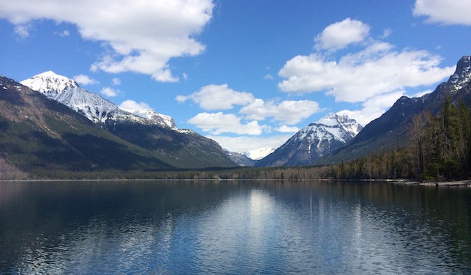 Snow-capped mountain near a calm lake in America