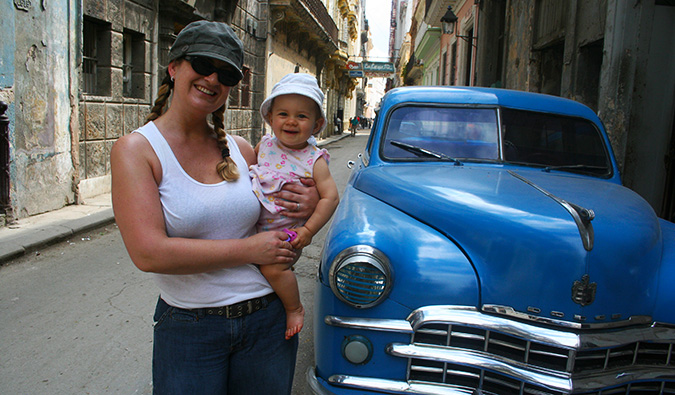 a mother traveler holding her baby