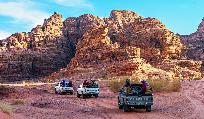 trucks driving through the desert in Jordan