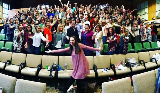 Best-selling author Vanessa Va Edwards posing with her audience