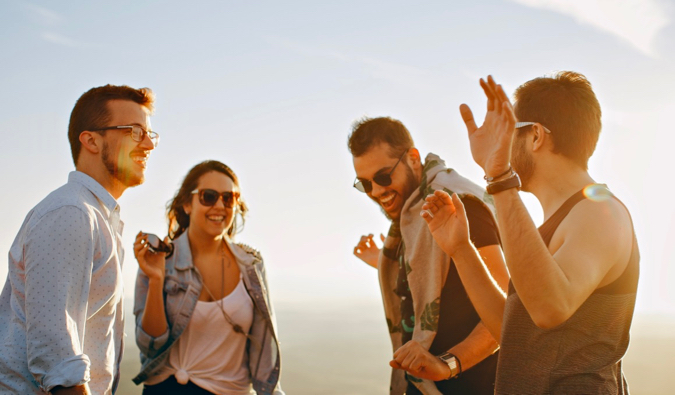 Travelers hanging out together outside