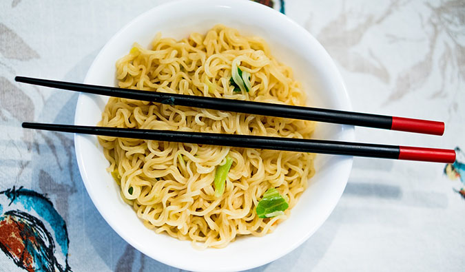 Japanese vegetarian ramen in a white bowl with chopsticks