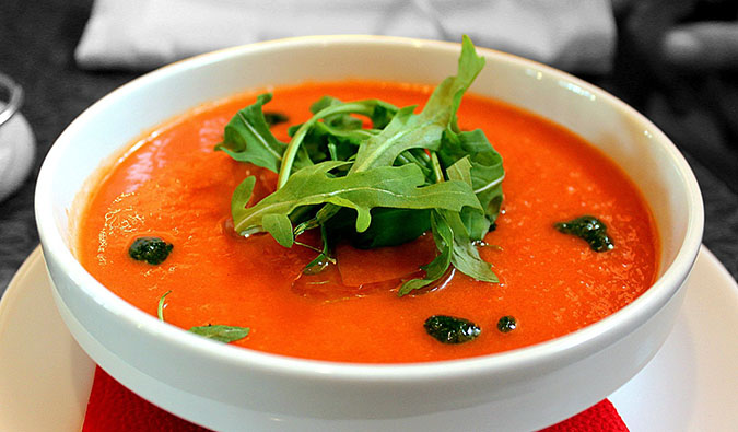 a vegetarian bowl of soup with a fancy garnish