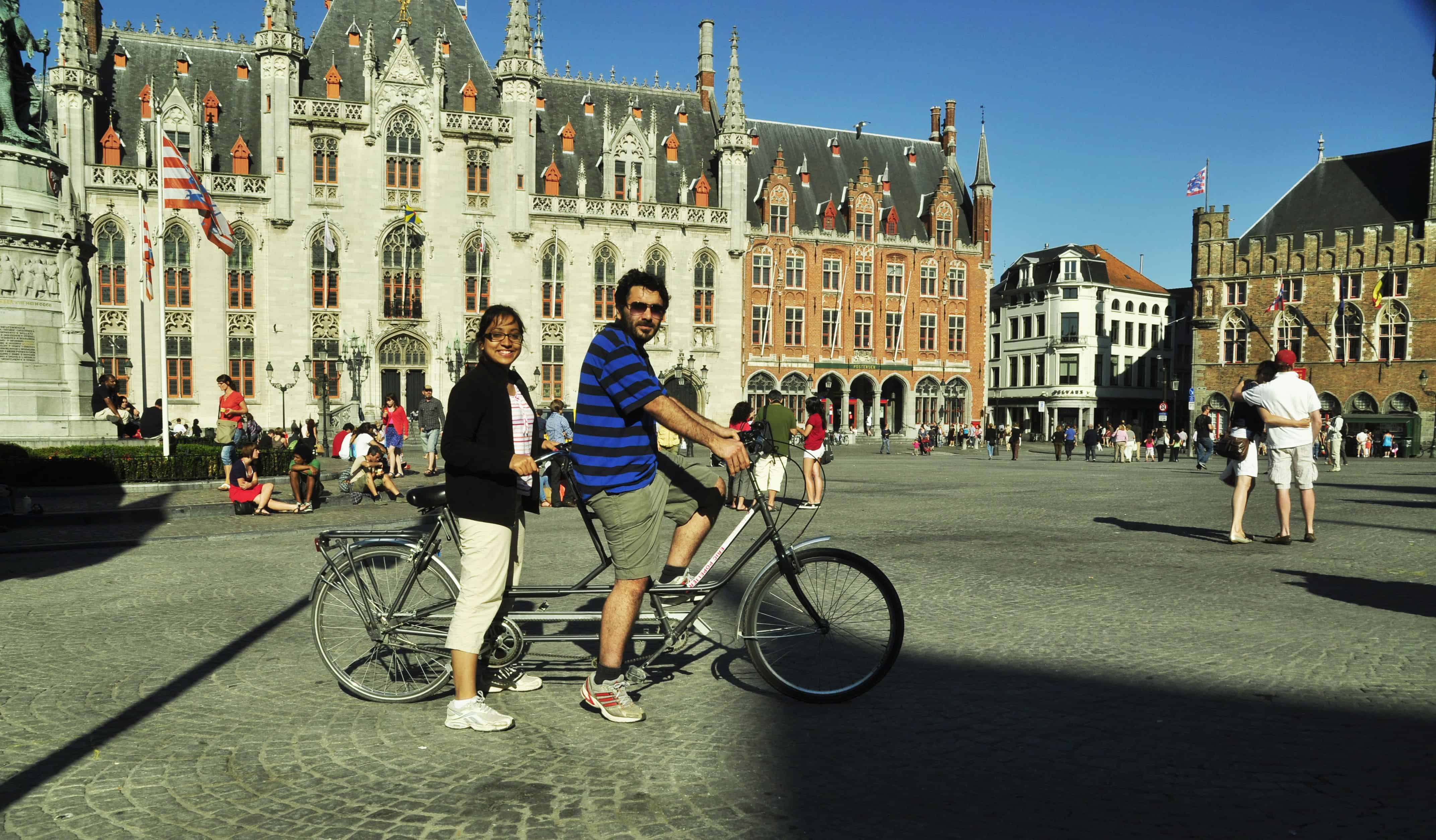 Vikram and Ishwinder from Empty Rusacks riding a tandem bike in Europe