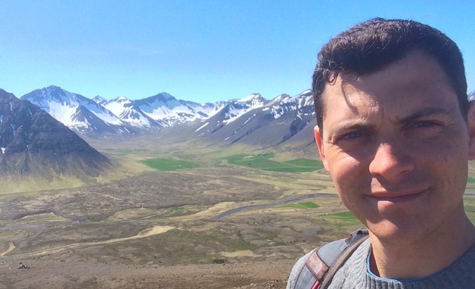Nomadic Matt posing for a selfie in the Westfjords, Iceland