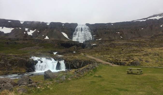 A lone waterfall cutting through the rocks of the Westfjords, Iceland